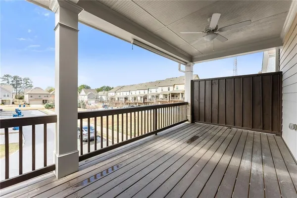 a view of a white building with a outdoor space