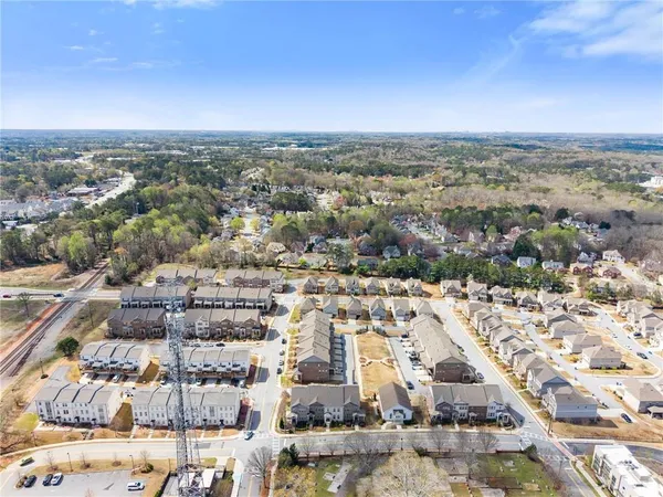 an aerial view of residential building and car parked