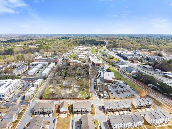 an aerial view of a swimming pool with a yard