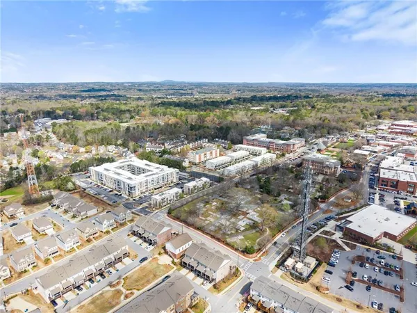 an aerial view of residential houses with outdoor space