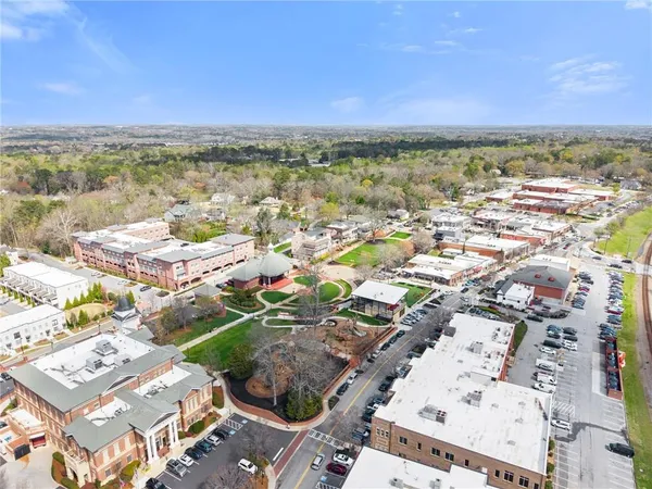 an aerial view of residential houses with outdoor space
