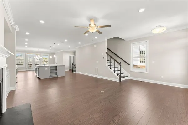 a large kitchen with stainless steel appliances granite countertop a stove and a sink