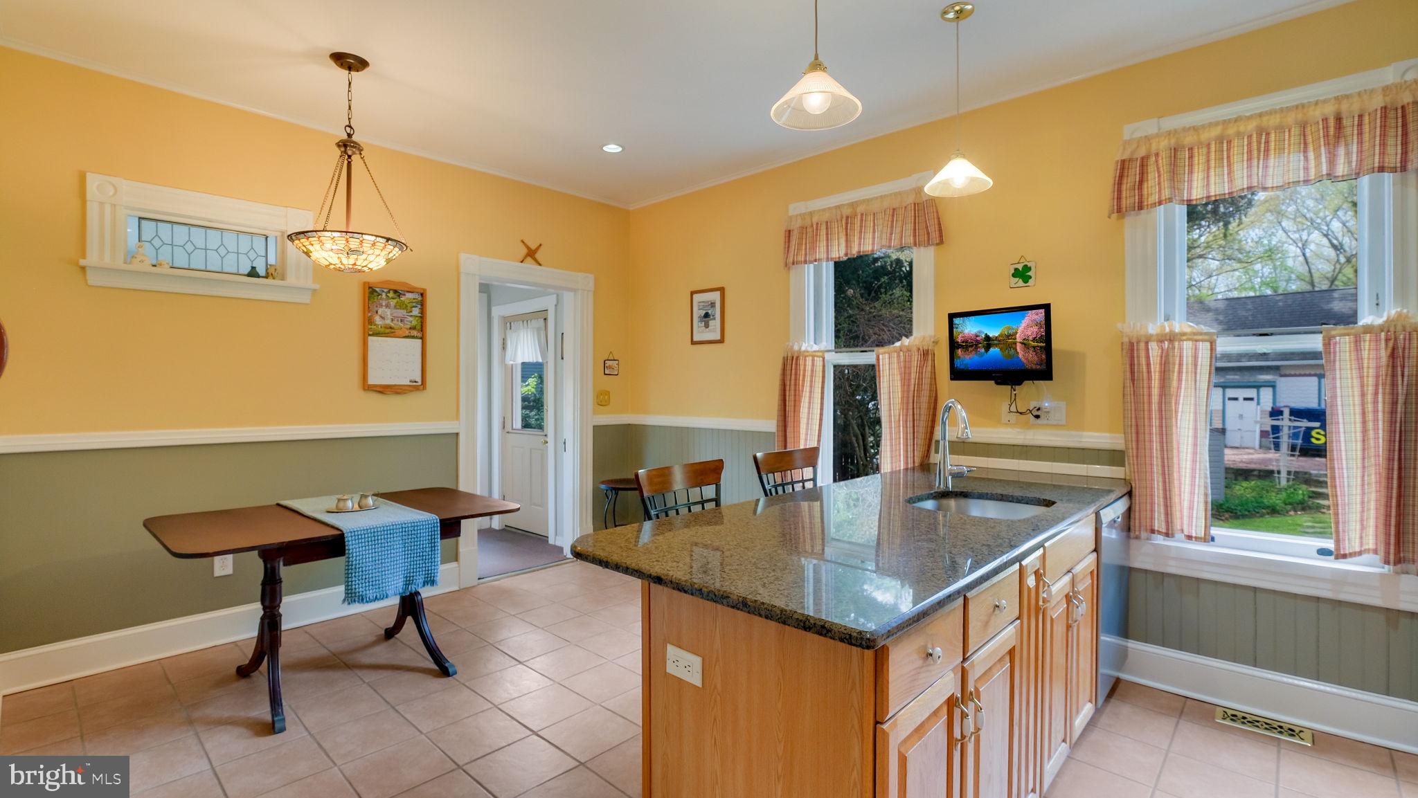 130 Woodland Road Wyncote, PA 19095 - Photo 10 of 37 a kitchen that has a counter space in it and a wooden floor