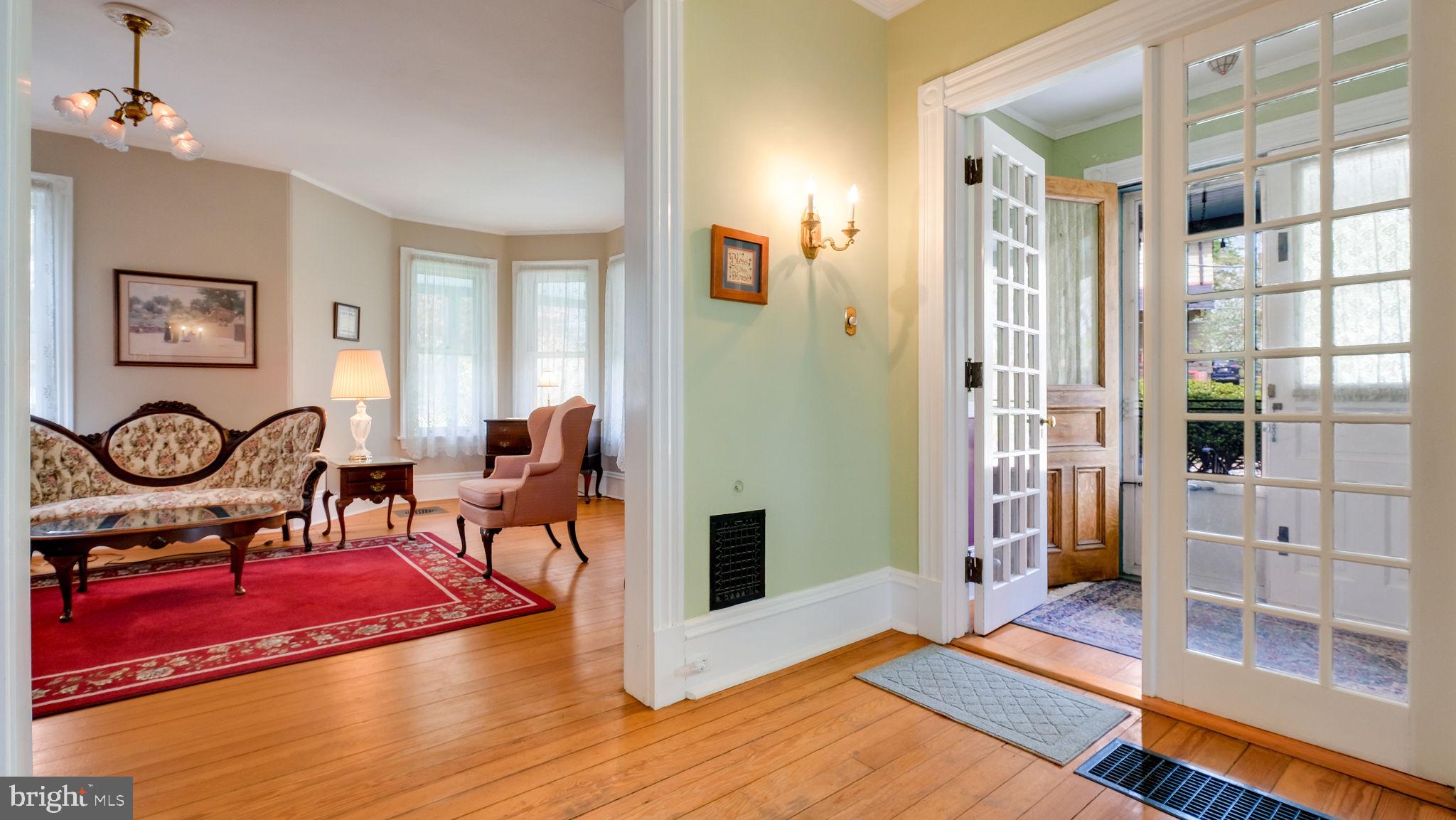 130 Woodland Road Wyncote, PA 19095 - Photo 32 of 37 a view of living room filled with furniture and windows