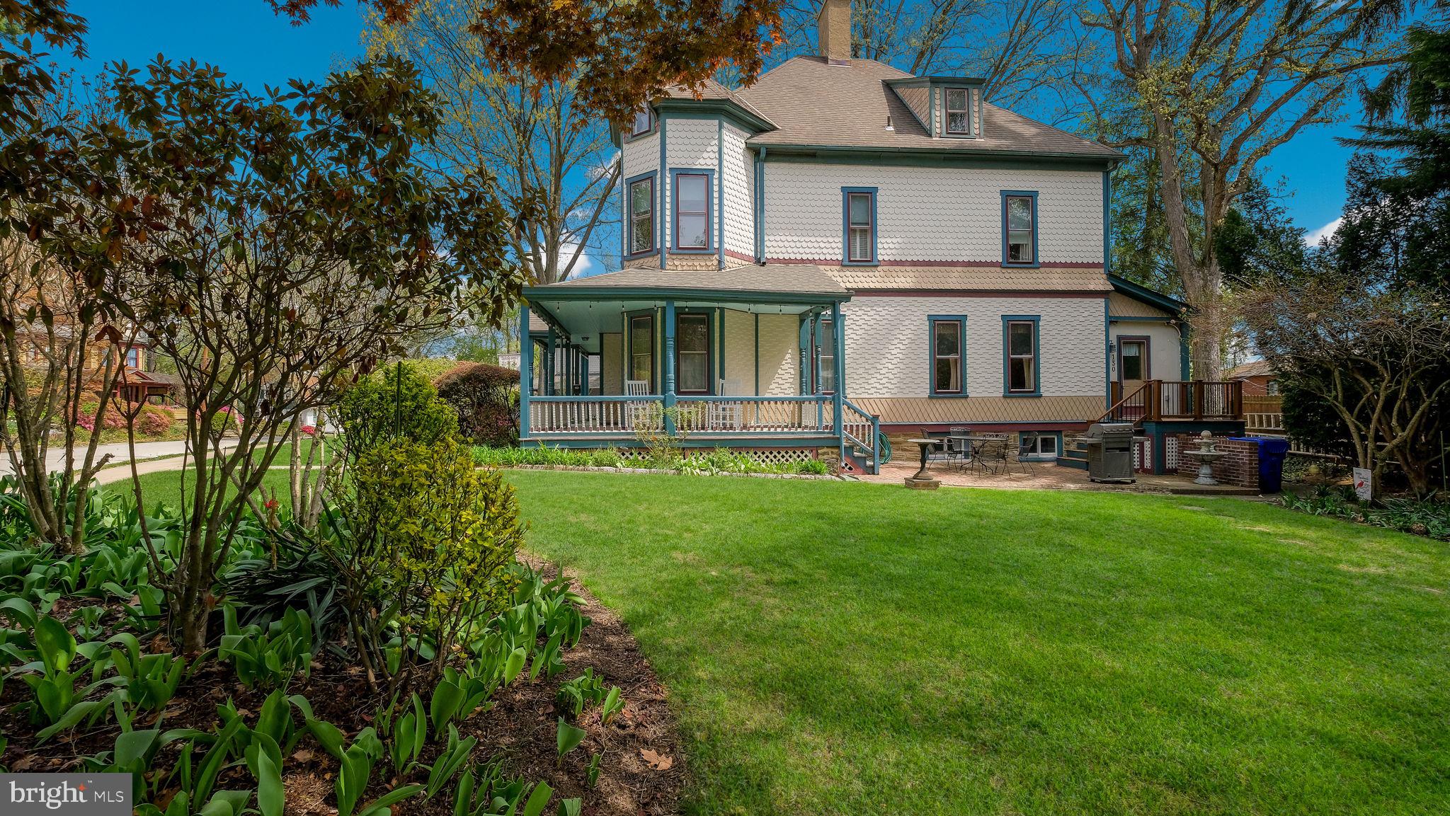 130 Woodland Road Wyncote, PA 19095 - Photo 35 of 37 a front view of a house with yard and green space