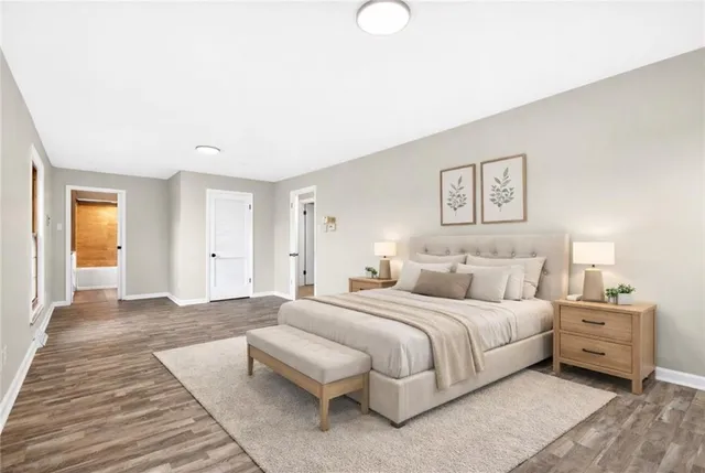 a spacious bedroom with a bed and a couch