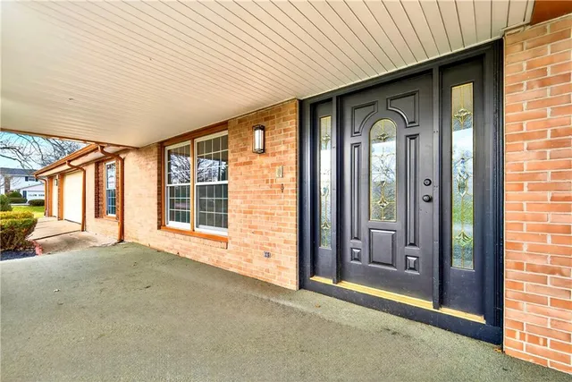 a view of a room with large windows