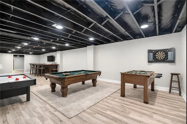 a room with furniture and pool table