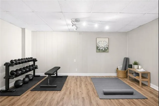 a living room with a couch and a wooden floor