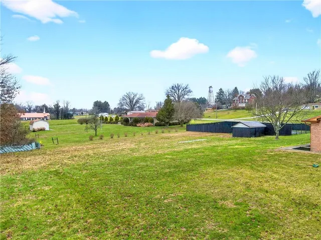a view of field with ocean view