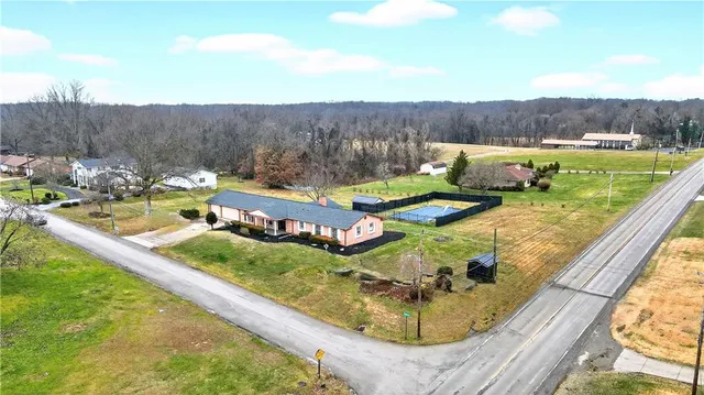 a view of a swimming pool with a yard and mountain view