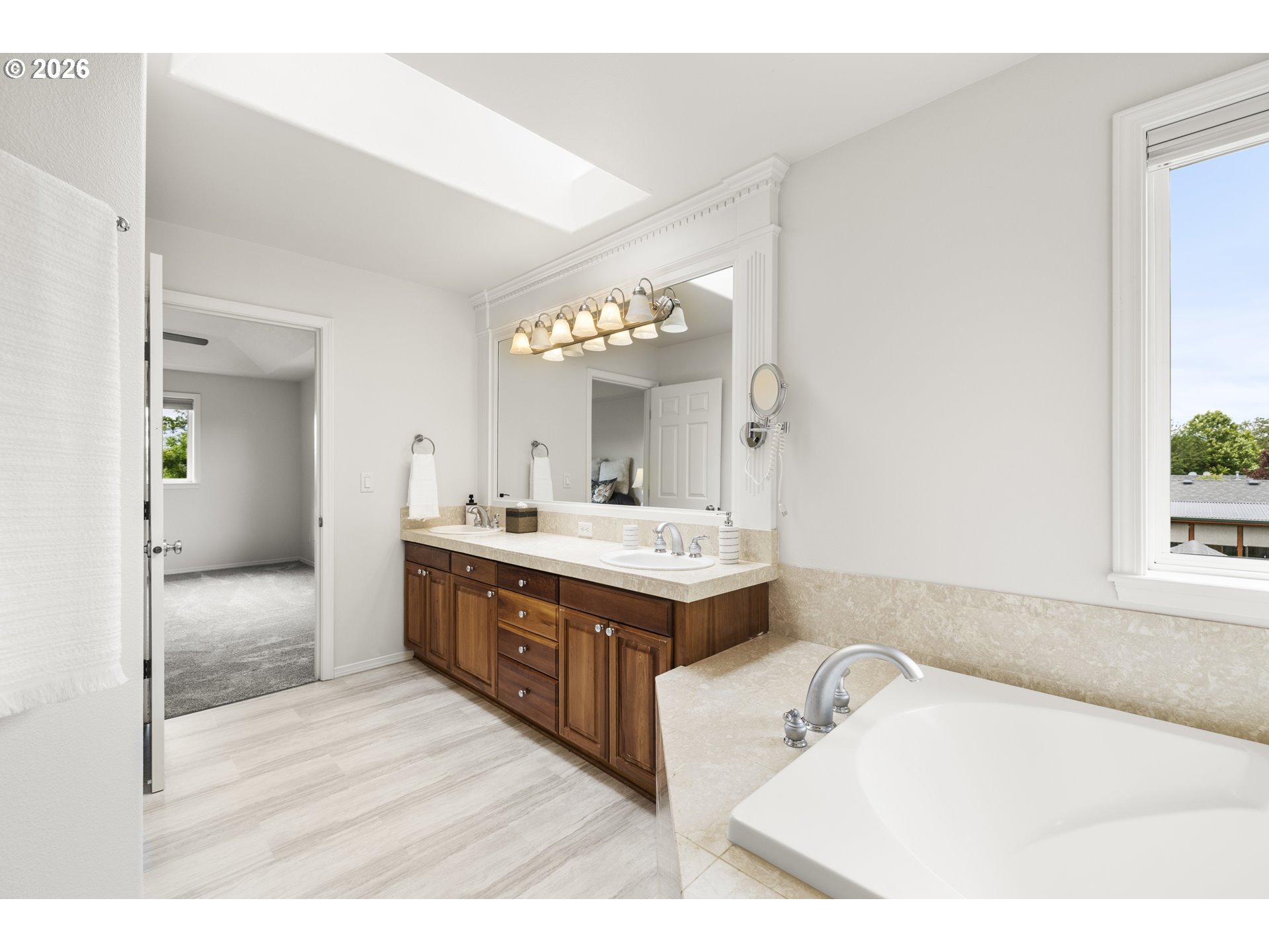 535 Maple Street Mount Angel, OR 97362 - Photo 27 of 48 a spacious bathroom with a tub sink and mirror
