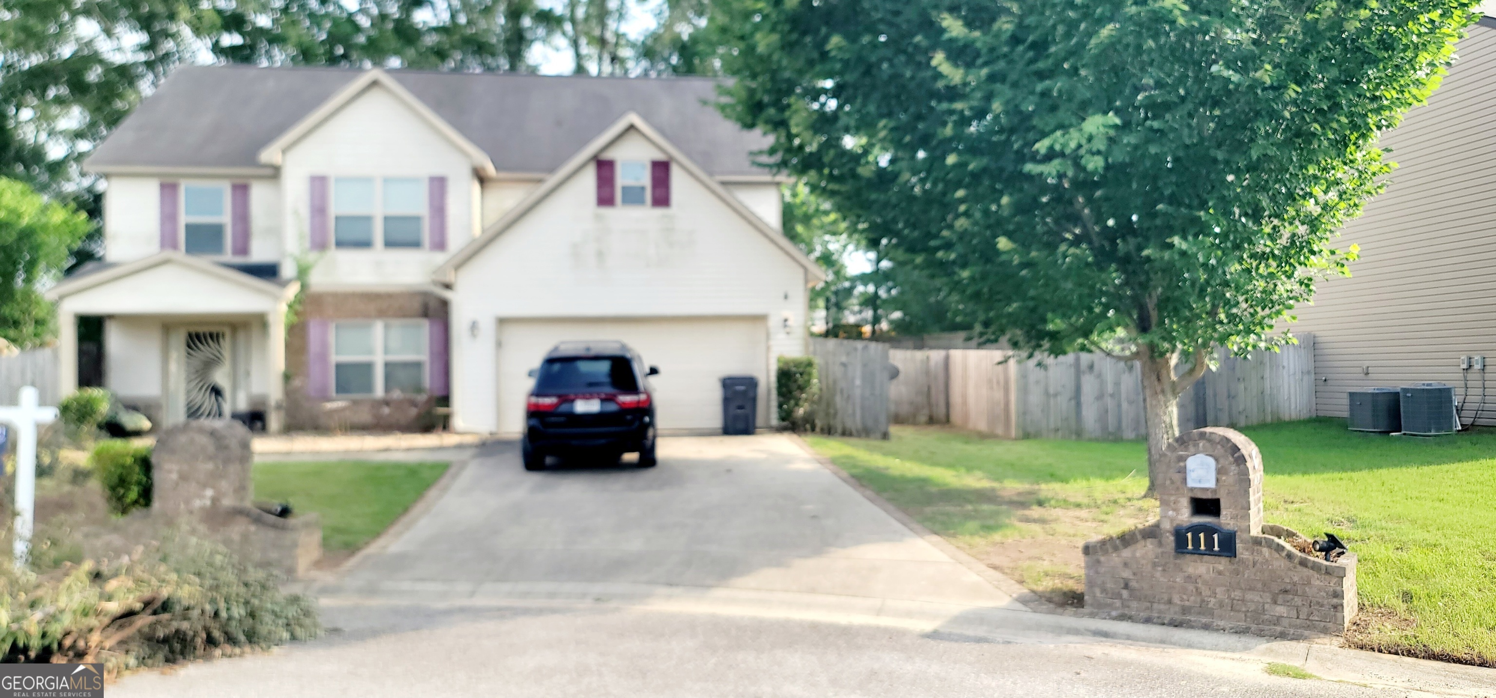 111 Tyndall Way Perry, GA 31069 - Photo 1 of 1 a front view of a house with a garden and porch