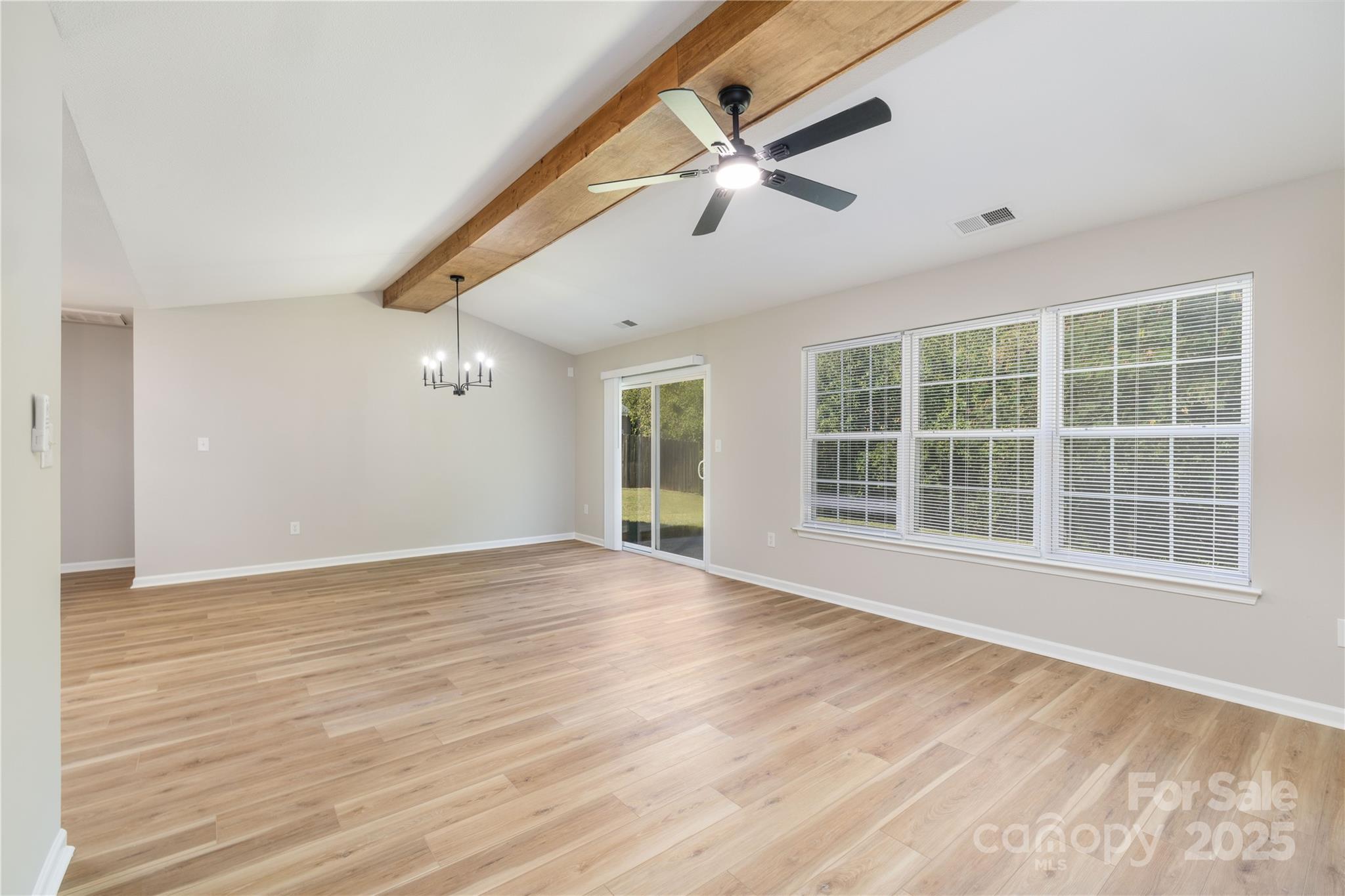 181 Mott Road Mooresville, NC 28115 - Photo 16 of 26 a view of an empty room with wooden floor and a window