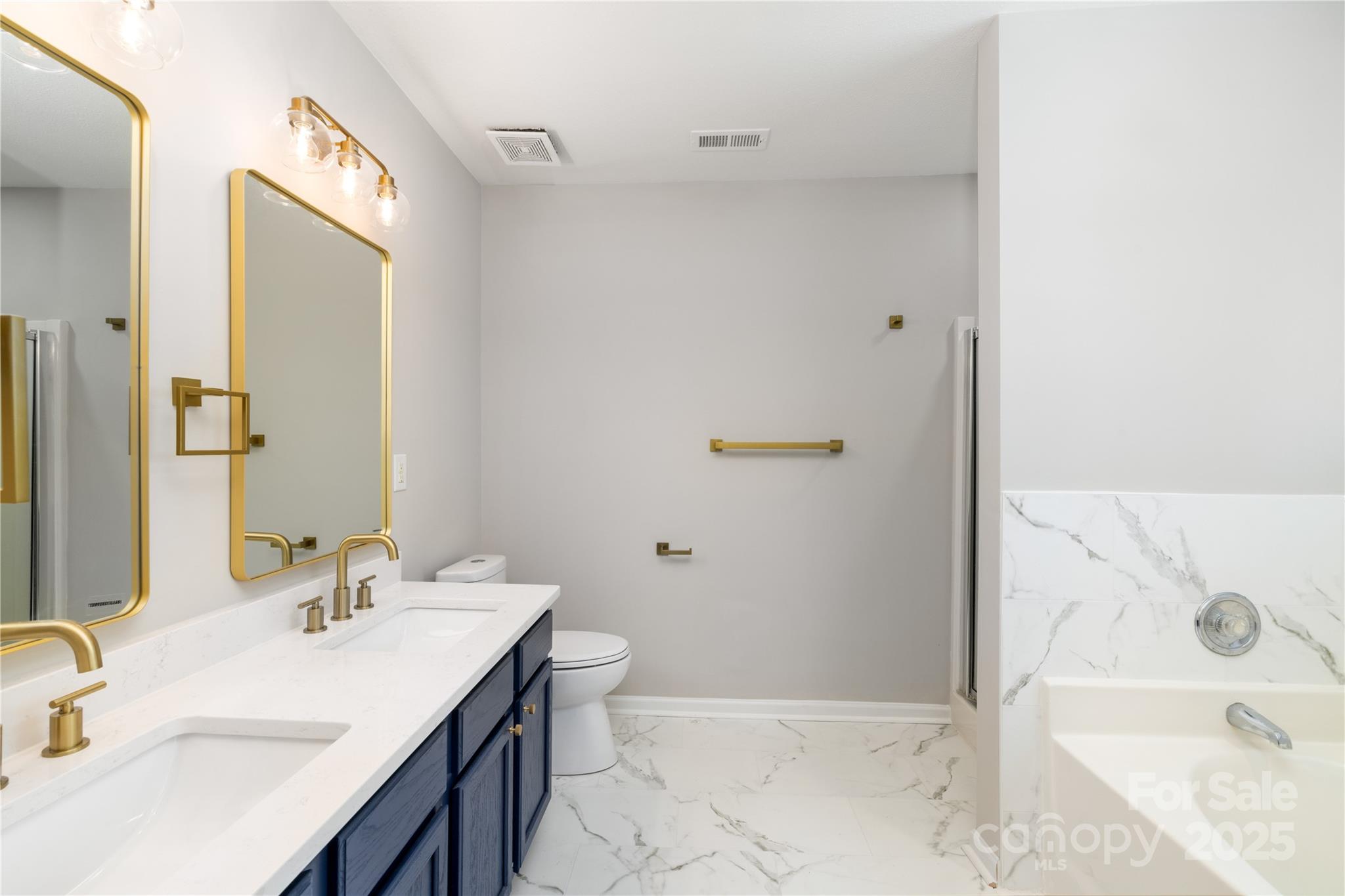 181 Mott Road Mooresville, NC 28115 - Photo 20 of 26 a bathroom with a granite countertop sink toilet and shower