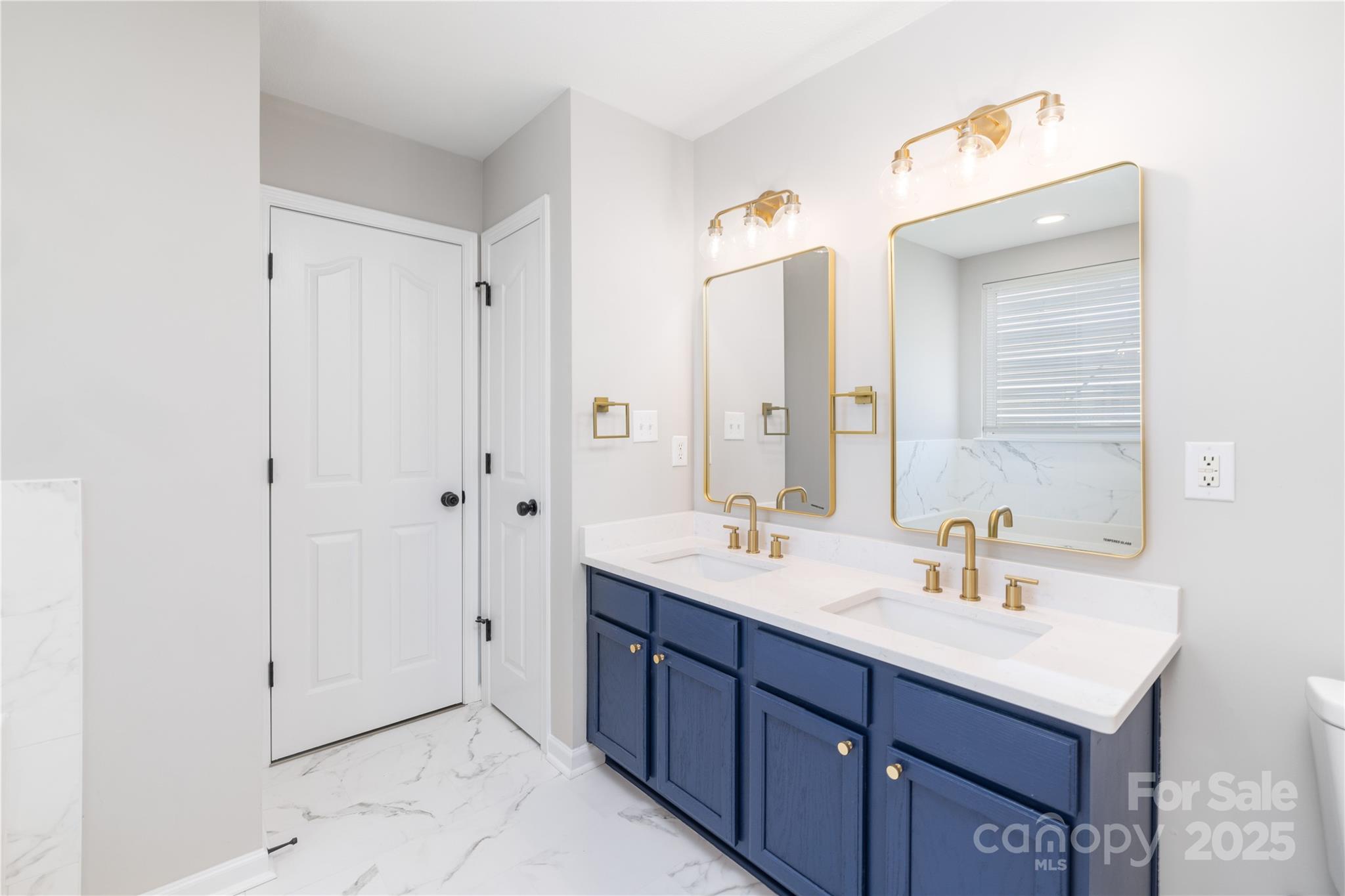 181 Mott Road Mooresville, NC 28115 - Photo 21 of 26 a bathroom with a double vanity sink and mirror