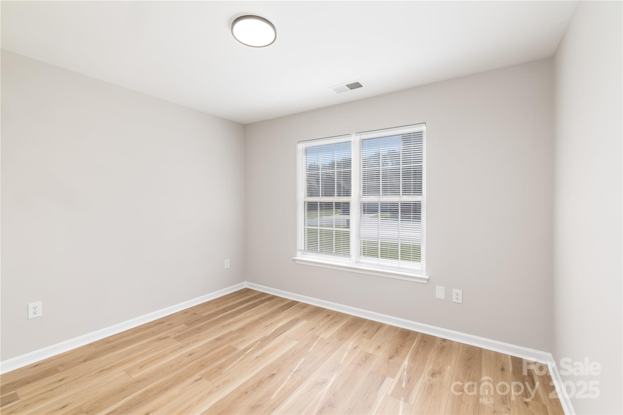 181 Mott Road Mooresville, NC 28115 - Photo 4 of 26 an empty room with a window