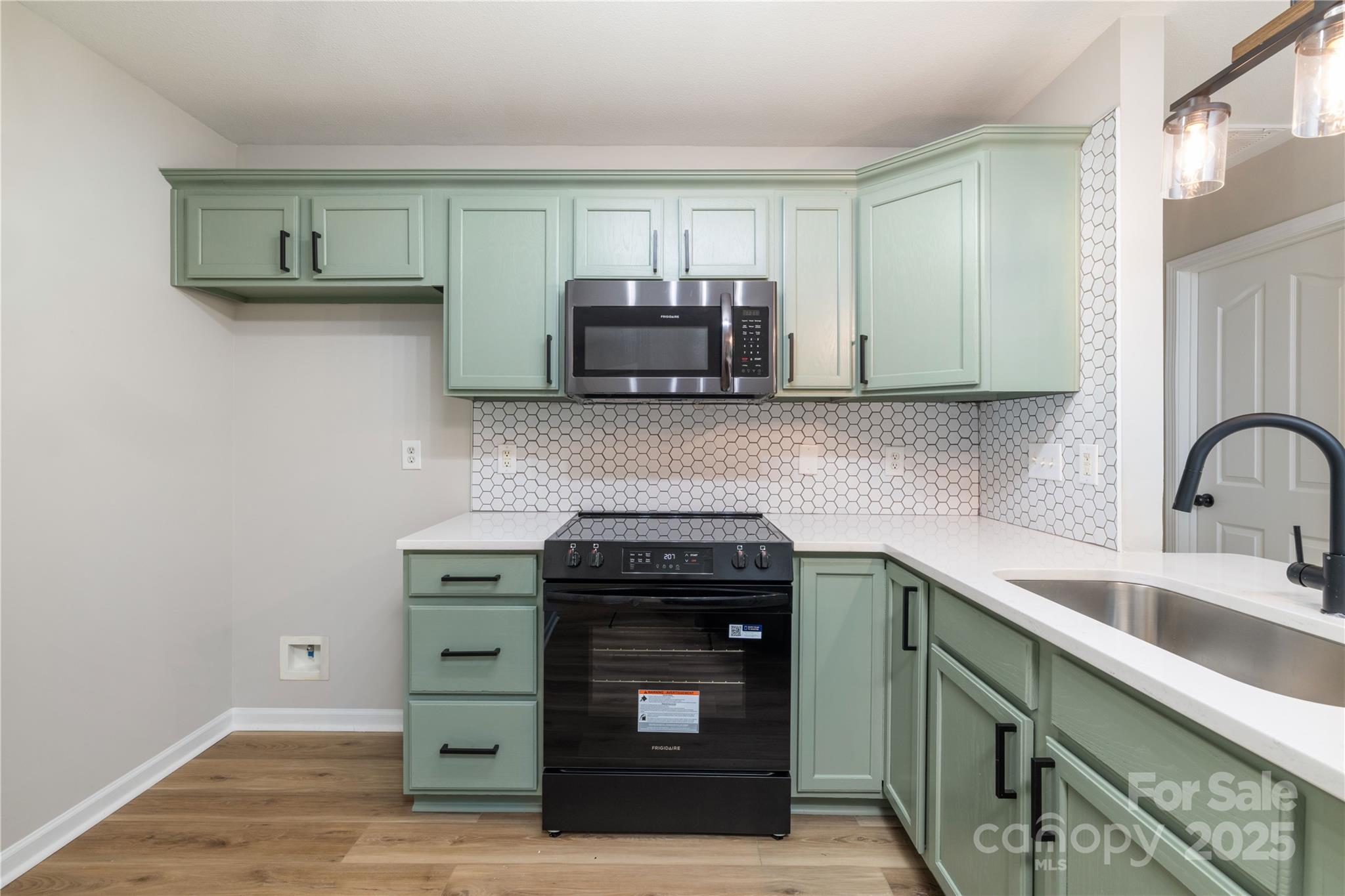 181 Mott Road Mooresville, NC 28115 - Photo 10 of 26 a kitchen with a sink and cabinets
