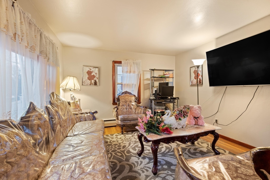 115 Windham Road Boston, MA 02136 - Photo 23 of 30 a living room with furniture and a flat screen tv