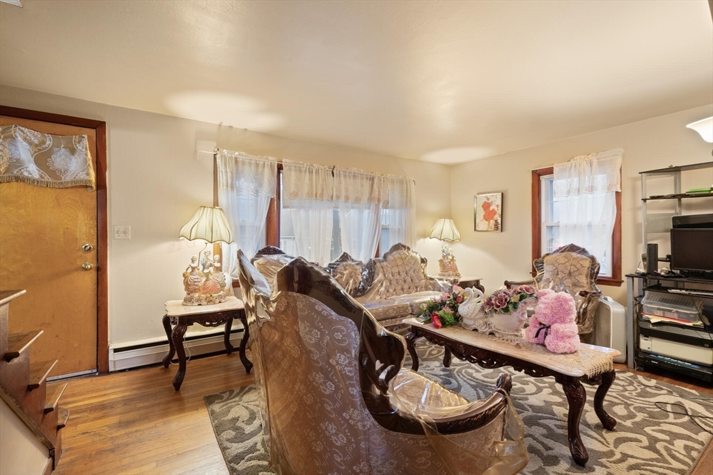 115 Windham Road Boston, MA 02136 - Photo 24 of 30 a living room with furniture a rug and a table