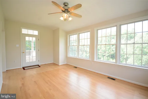 a view of kitchen with sink and wooden floor