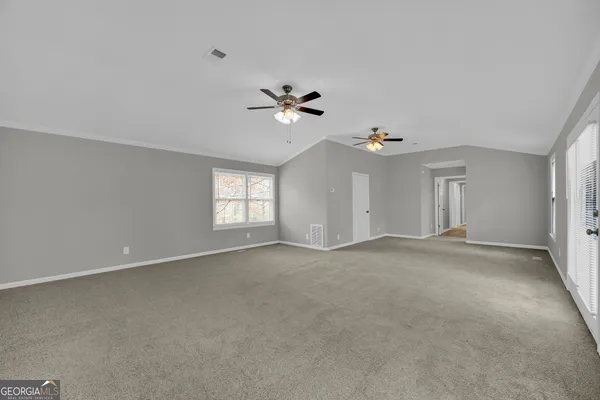 an empty room with a fireplace
