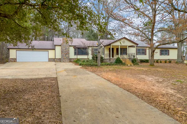 a view of a house with porch and wooden floor