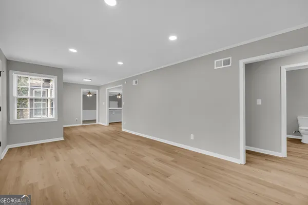 a kitchen with stainless steel appliances granite countertop a stove and a refrigerator