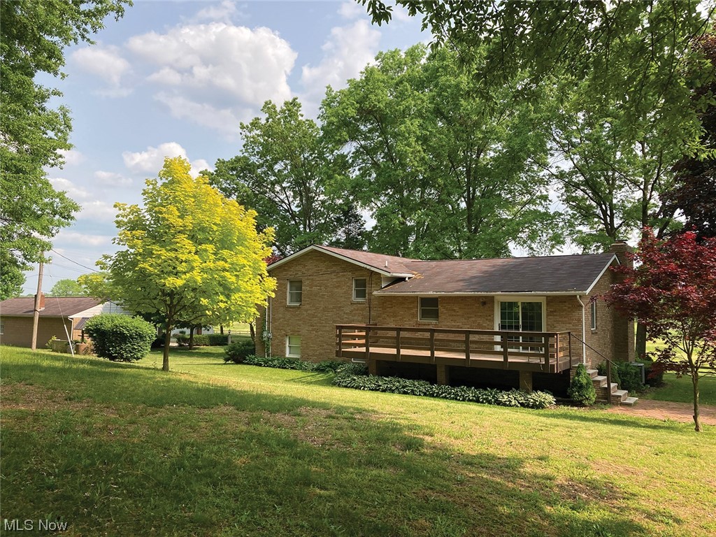1525 Hartville Road Atwater, OH 44201 - Photo 8 of 18 Back of brick home with composite deck