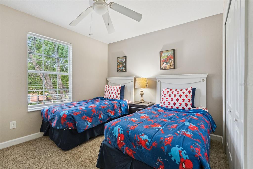 8965 Cuban Palm Road Kissimmee, FL 34747 - Photo 21 of 77 a bedroom with two beds and a window