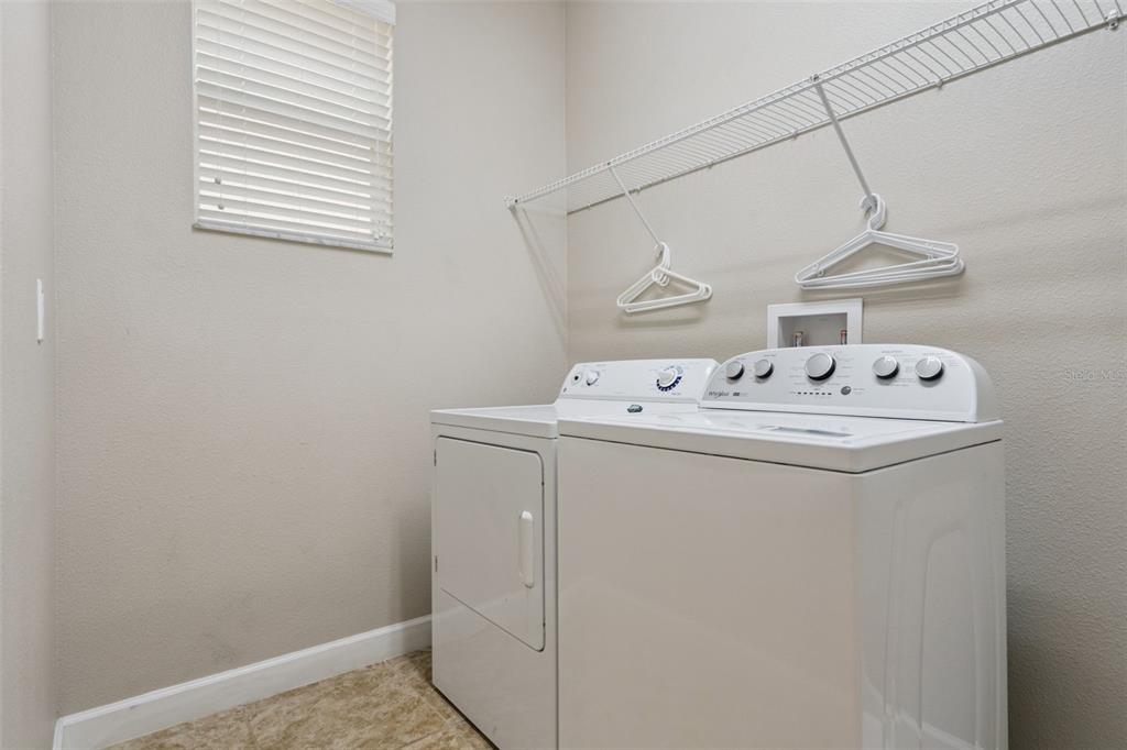 8965 Cuban Palm Road Kissimmee, FL 34747 - Photo 28 of 77 a utility room with dryer and washer