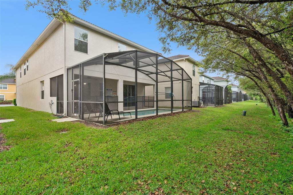 8965 Cuban Palm Road Kissimmee, FL 34747 - Photo 32 of 77 a view of a house with backyard and garden