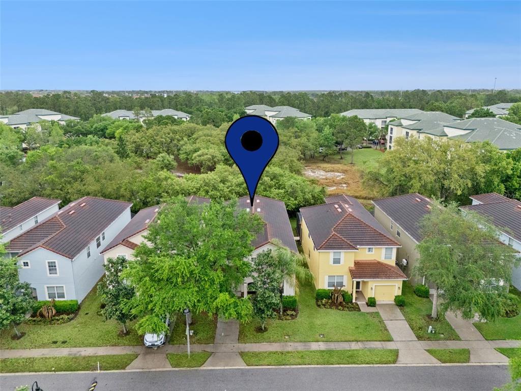 8965 Cuban Palm Road Kissimmee, FL 34747 - Photo 33 of 77 an aerial view of residential houses with outdoor space and street view