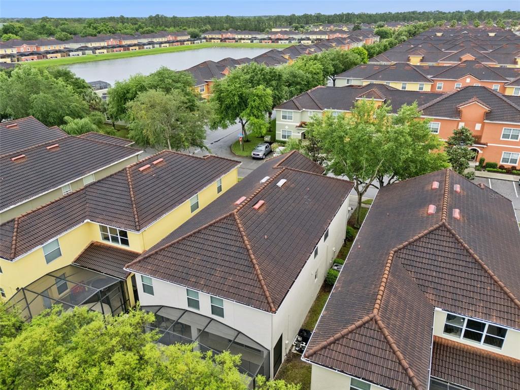 8965 Cuban Palm Road Kissimmee, FL 34747 - Photo 36 of 77 an aerial view of a house with outdoor space and lake view