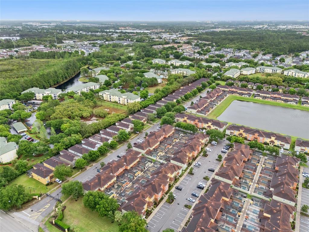 8965 Cuban Palm Road Kissimmee, FL 34747 - Photo 37 of 77 an aerial view of residential houses with outdoor space