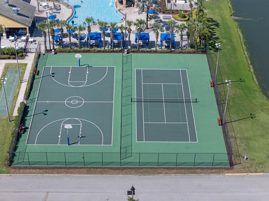 8965 Cuban Palm Road Kissimmee, FL 34747 - Photo 44 of 77 a front view of a house with a garden