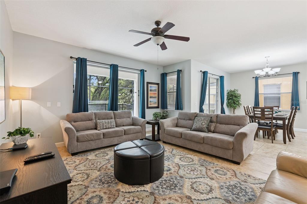 8965 Cuban Palm Road Kissimmee, FL 34747 - Photo 6 of 77 a living room with furniture and a large window
