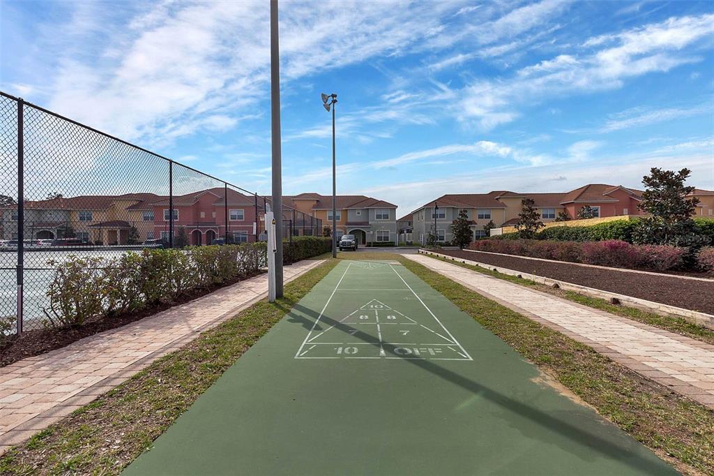 8965 Cuban Palm Road Kissimmee, FL 34747 - Photo 72 of 77 a view of a house with a yard and a car park