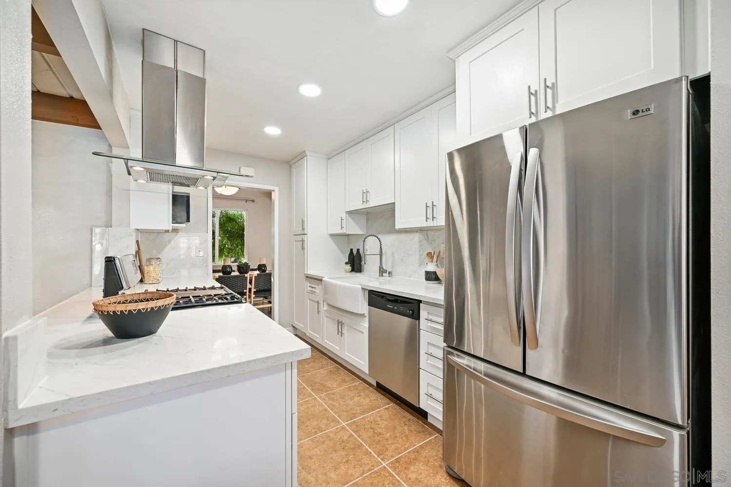 720 Fern Street Escondido, CA 92027 - Photo 12 of 28 a kitchen with stainless steel appliances a refrigerator and a stove top oven