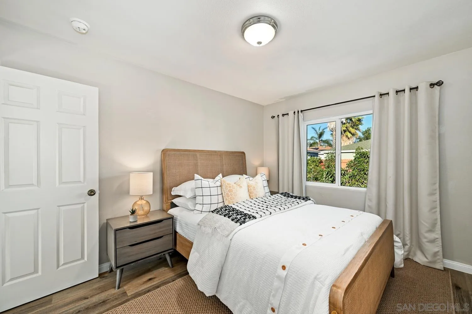 720 Fern Street Escondido, CA 92027 - Photo 15 of 28 a bedroom with a bed and a window