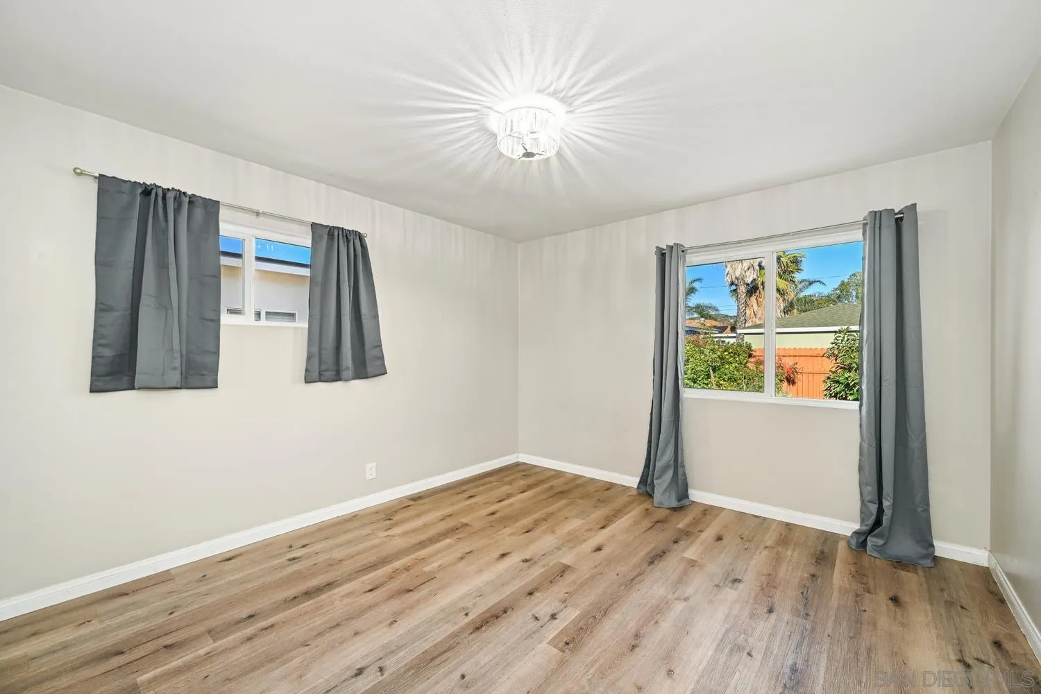 720 Fern Street Escondido, CA 92027 - Photo 18 of 28 a view of empty room with wooden floor and fan