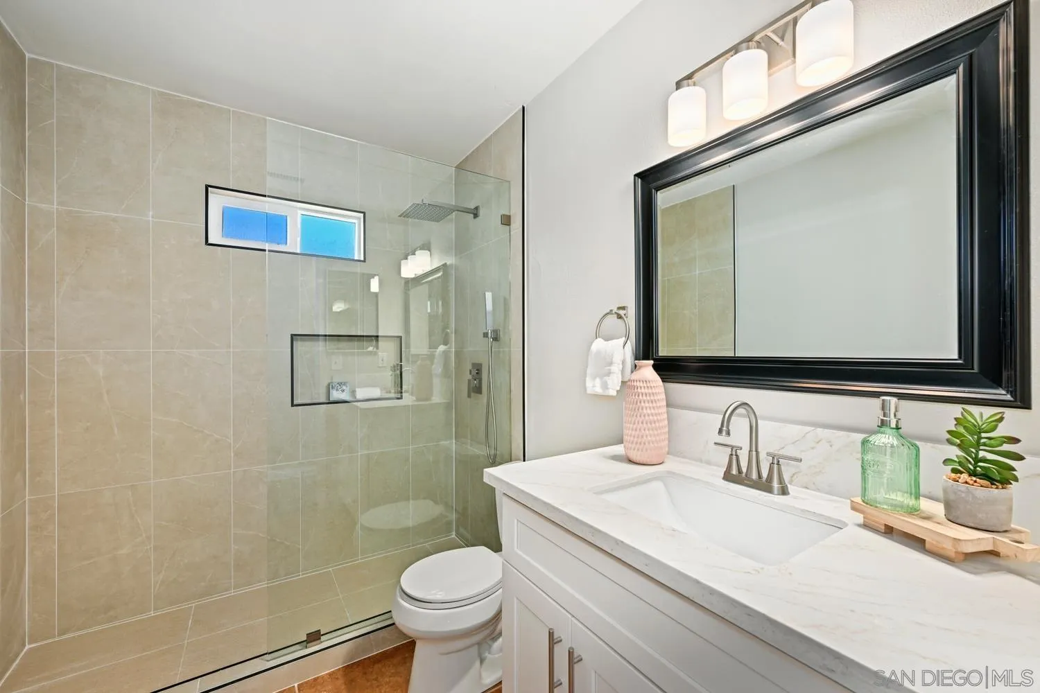720 Fern Street Escondido, CA 92027 - Photo 19 of 28 a bathroom with a granite countertop sink a mirror and a toilet