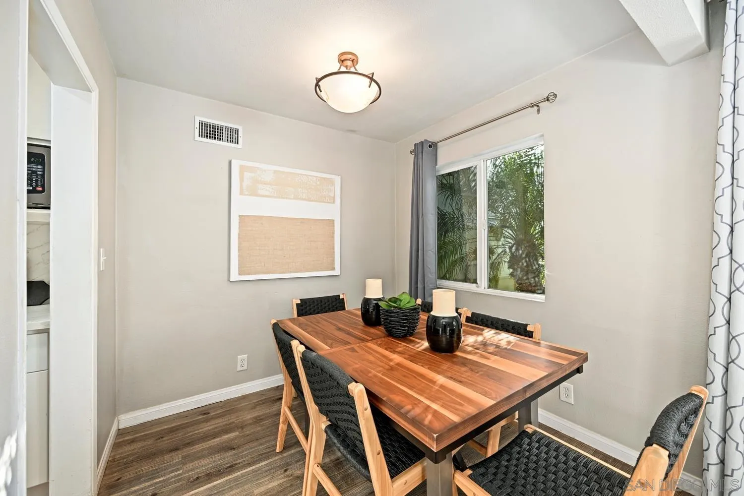720 Fern Street Escondido, CA 92027 - Photo 5 of 28 a view of a dining room with a table and chairs