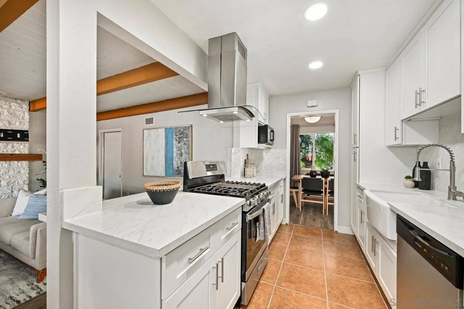 720 Fern Street Escondido, CA 92027 - Photo 6 of 28 a kitchen with stainless steel appliances a stove a sink and a refrigerator