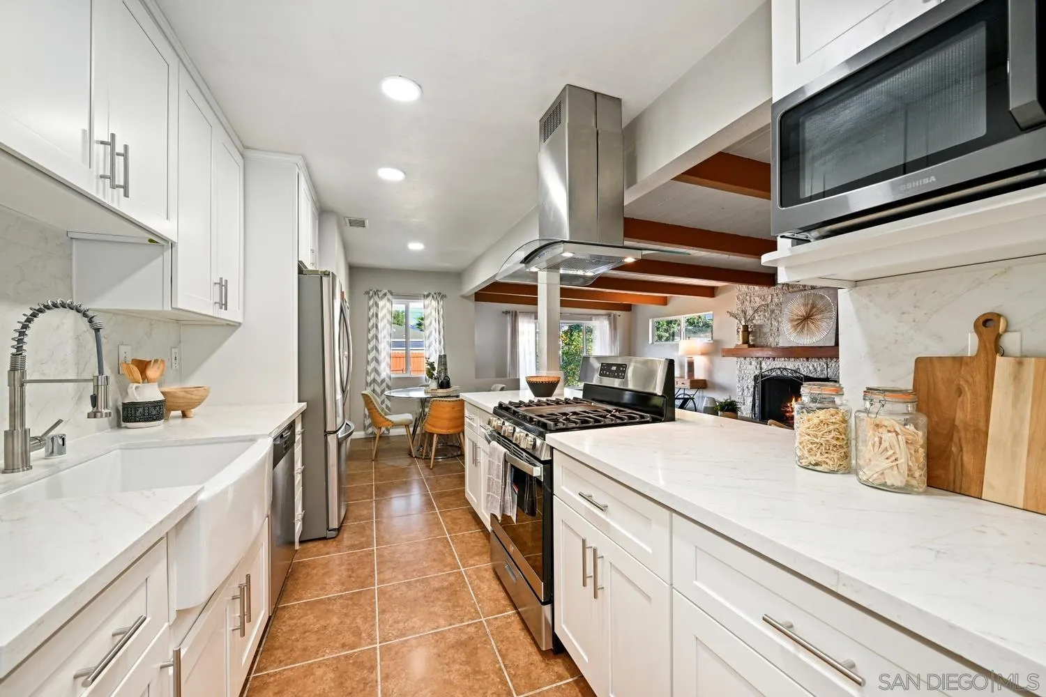 720 Fern Street Escondido, CA 92027 - Photo 7 of 28 a kitchen with stainless steel appliances granite countertop a sink and stove
