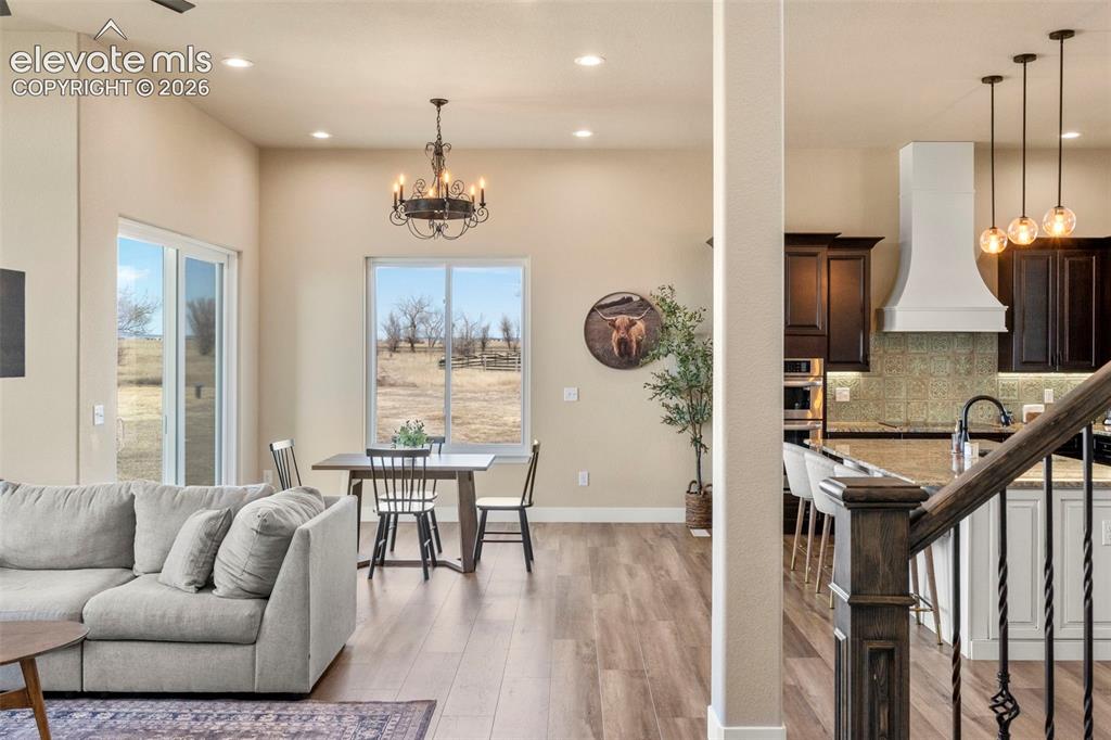 2480 North Log Road Calhan, CO 80808 - Photo 15 of 50 Open concept living area with luxury vinyl floors throughout