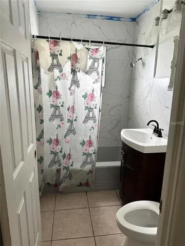 a bathroom with a sink and toilet