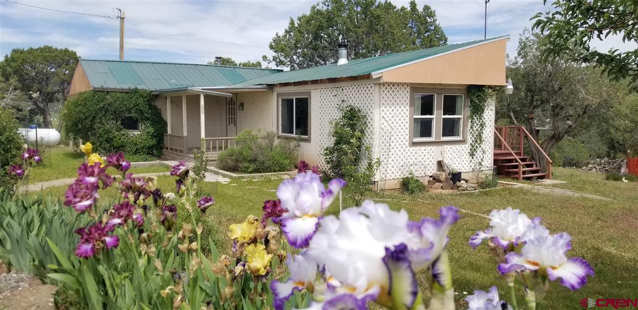 15584 Heavens View Road Cedaredge, CO 81413 - Photo 1 of 1 a front view of house with yard