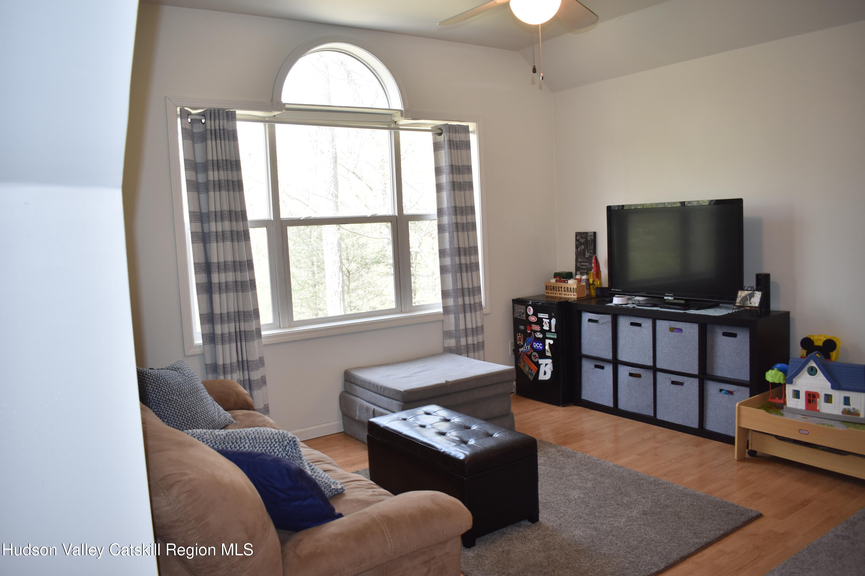 125 Hardenburgh Road Ulster Park, NY 12487 - Photo 24 of 45 a living room with furniture and a flat screen tv