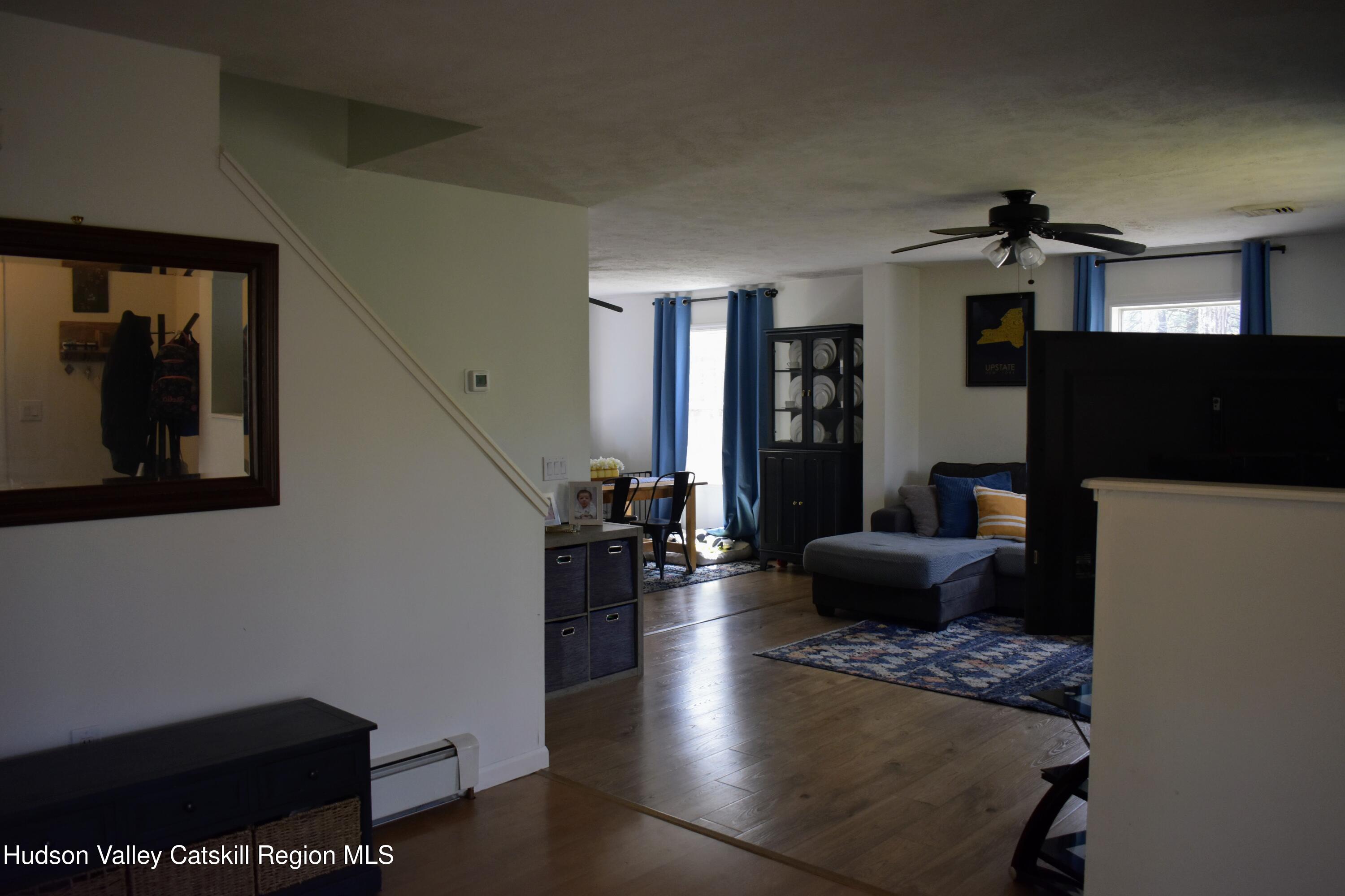 125 Hardenburgh Road Ulster Park, NY 12487 - Photo 7 of 45 a living room with furniture and a flat screen tv